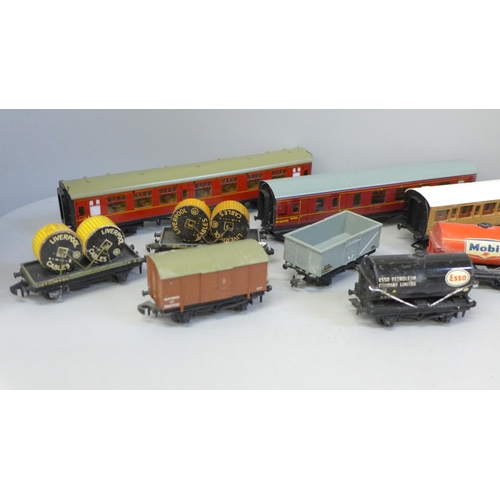 653 - Hornby OO gauge model rail, three coaches and a collection of wagons