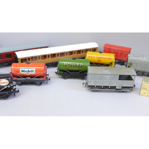 653 - Hornby OO gauge model rail, three coaches and a collection of wagons