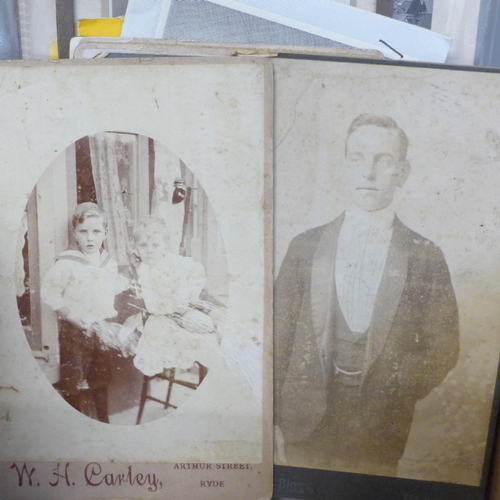 657 - A carte de visite album, cabinet cards and some loose photographs