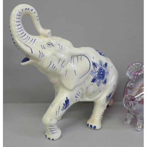 671 - A large hand painted Delft elephant, 37cm and a pink cased glass pig money box, 19cm