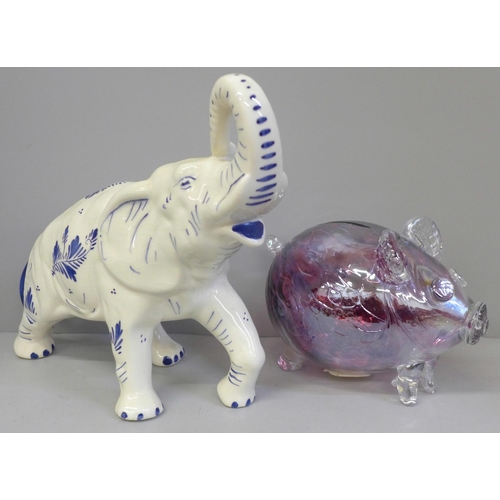 671 - A large hand painted Delft elephant, 37cm and a pink cased glass pig money box, 19cm