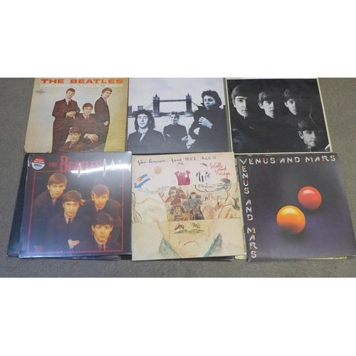 676 - Twelve The Beatles and solo LP records, including numbered White Album