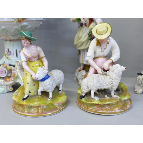 677 - A pair of Staffordshire figures, sheep shearer and companion and two Continental figures, small loss... 