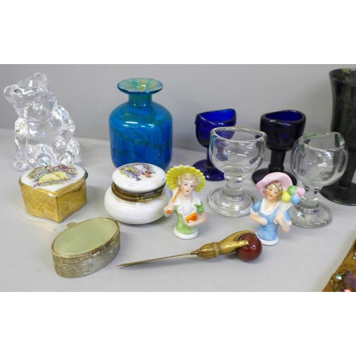 678 - Glass eye baths, a compact and a Mdina glass vase, etc.