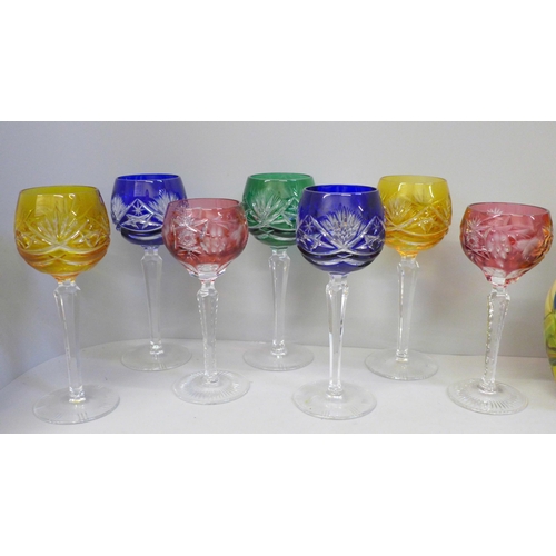 679 - Seven etched coloured hock glasses, a coloured glass candlestick and vase **PLEASE NOTE THIS LOT IS ... 