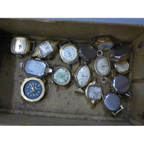 724 - A tub of lady's wristwatches and a box of watch spares