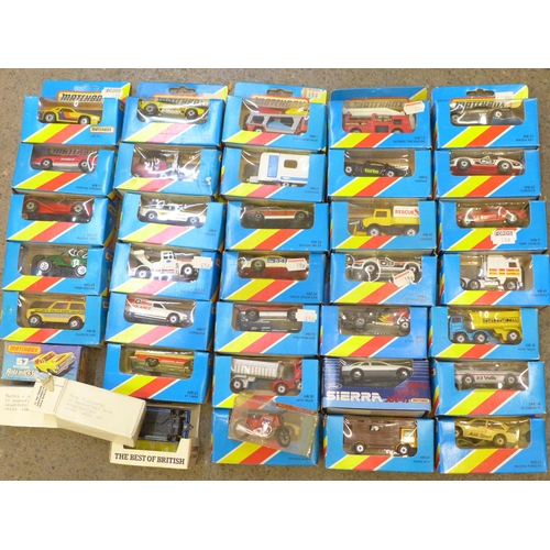 731 - A collection of twenty early 1980s carded Matchbox die-cast vehicles and four others, boxed