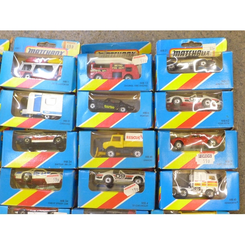 731 - A collection of twenty early 1980s carded Matchbox die-cast vehicles and four others, boxed