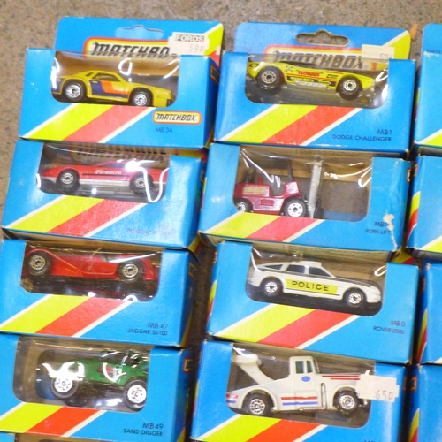 731 - A collection of twenty early 1980s carded Matchbox die-cast vehicles and four others, boxed