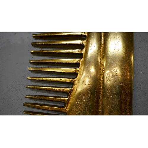 1380 - A large gold metal comb