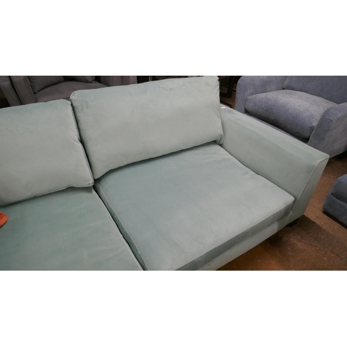 1399 - A large green velvet sofa/chaise