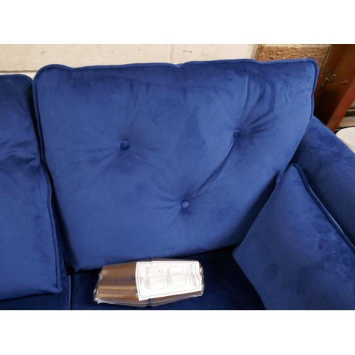 1412 - A Hoxton blue velvet two seater sofa RRP £779