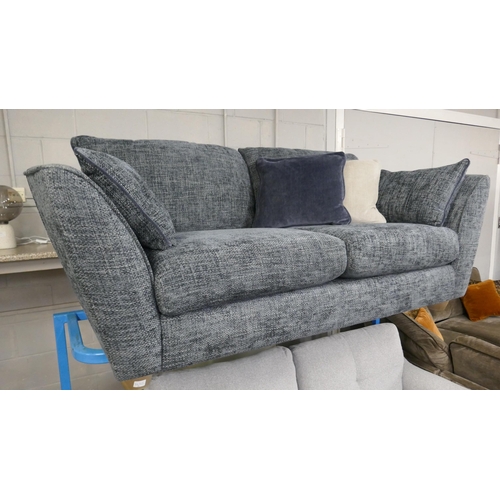 1632 - A blue hopsack three seater sofa