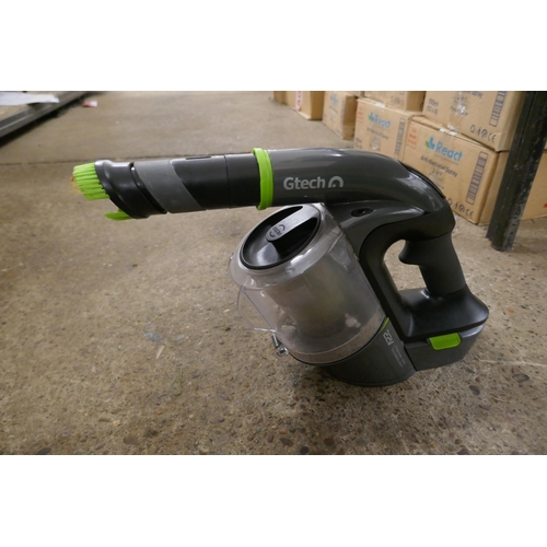 2456 - A Gtech 22v 2000 MAH cordless hand held vacuum cleaner with charger and attachments - model no. ATF-... 