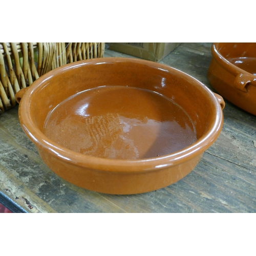 2466 - A collection of terracotta and Tappas cooking dishes