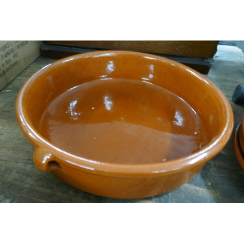 2466 - A collection of terracotta and Tappas cooking dishes