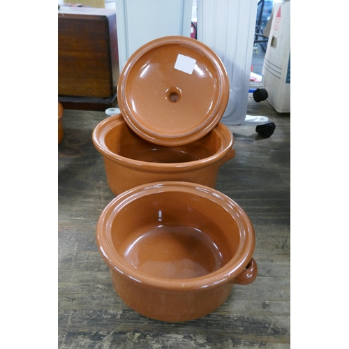 2466 - A collection of terracotta and Tappas cooking dishes