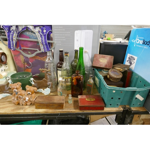 2496 - A collection of vintage bottles and tin boxes, a cast iron doorstop and a Christmas tree stand