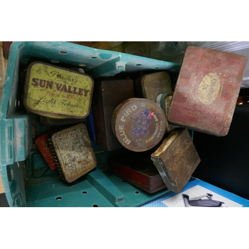 2496 - A collection of vintage bottles and tin boxes, a cast iron doorstop and a Christmas tree stand