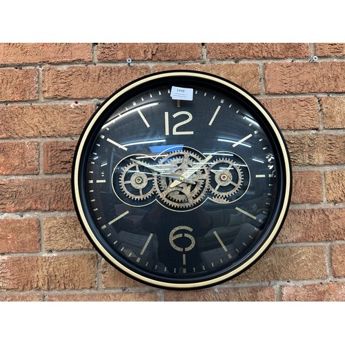 1498 - A black and gold moving gears wall clock