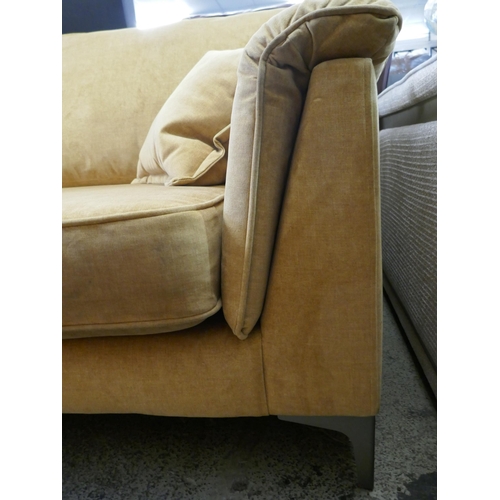 1615 - A turmeric velvet three seater sofa