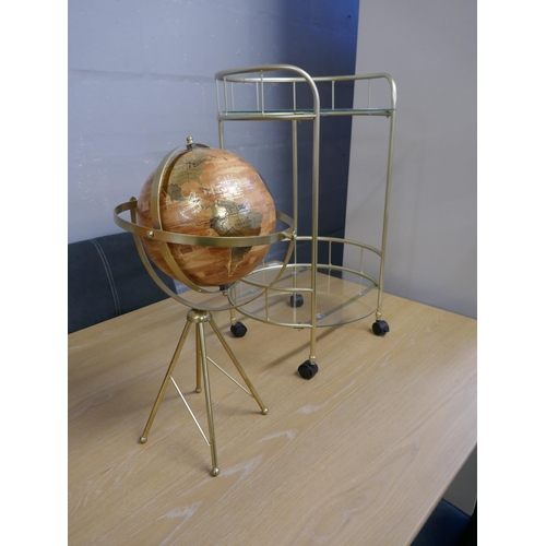 1629 - A globe on a stand and a gold painted two tier drinks trolley