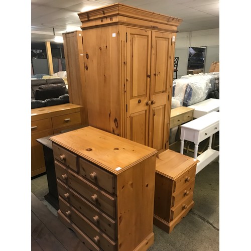 1579 - Pine bedroom suite, comprising of a double wardrobe, a five drawer chest and a three drawer bedside ... 