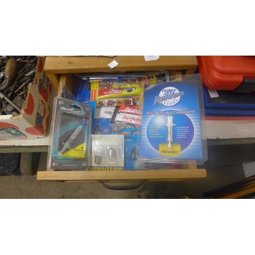 2002 - 2 Workshop drawers of consumables including chemical metal glue, automotive bulbs, Araldite adhesive... 