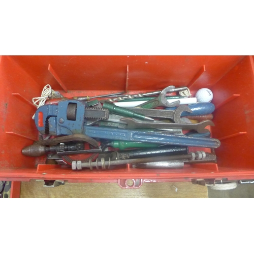 2025 - A red plastic toolbox and tools including drill bits, drop forged steel monkey wrench, spanners, han... 