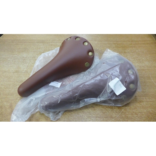 2105 - 2 Traditional style bike saddles in brown faux leather - unused