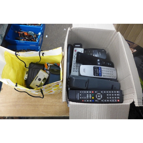 2128 - A box of approximately 60 various remote controls, 8 cameras including Chinon, Samsung, Praktica, Mi... 