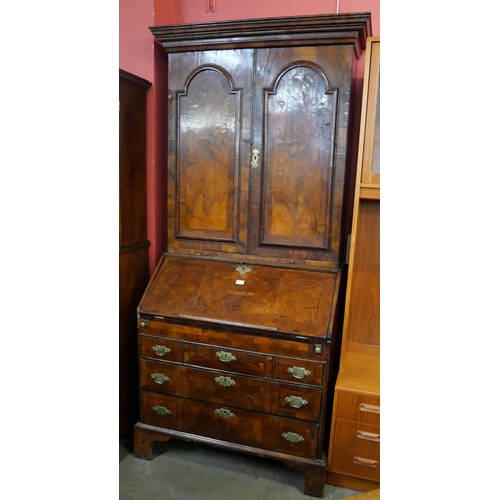 100 - A George I walnut bureau bookcase