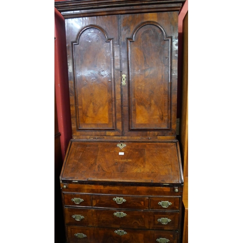 100 - A George I walnut bureau bookcase