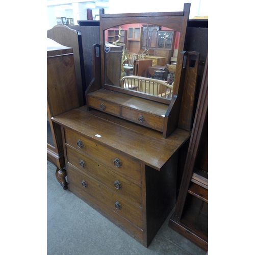 123 - An Arts and Crafts oak dressing table