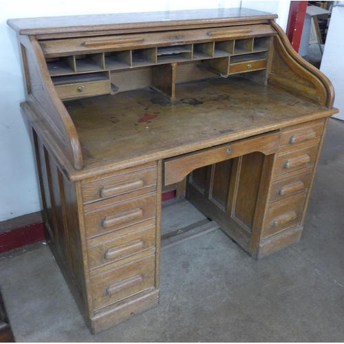 126 - An early 20th Century oak tambour roll top desk