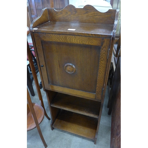 153 - An oak single door open bookcase