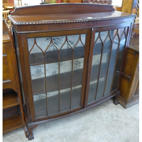 157 - An early 20th Century mahogany two door bow front display cabinet