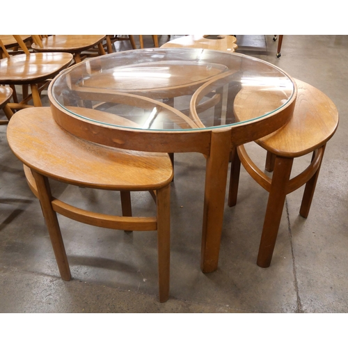 16 - A Nathan Trinity teak and glass topped circular coffee table