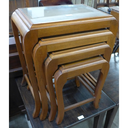 191 - An eastern carved hardwood nest of quartetto tables