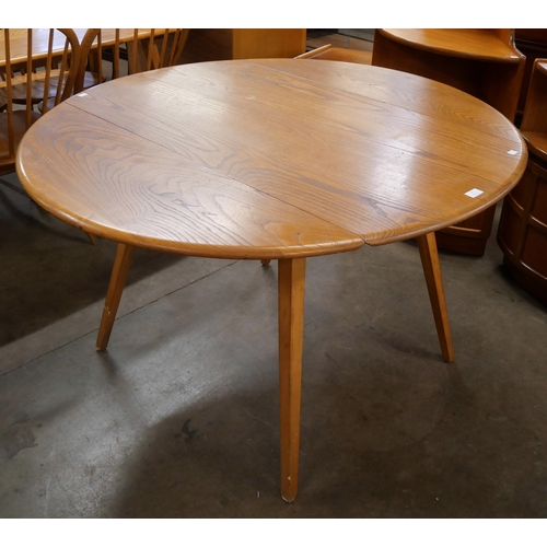 21 - An Ercol Blonde elm and beech Windsor drop-leaf table