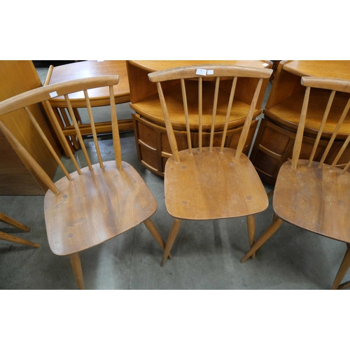 22 - A set of four Ercol Blonde elm and beech chairs