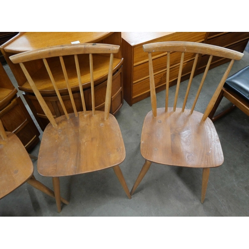 22 - A set of four Ercol Blonde elm and beech chairs