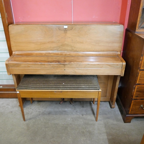 245 - A teak upright piano with faux ivory keys and a piano stool