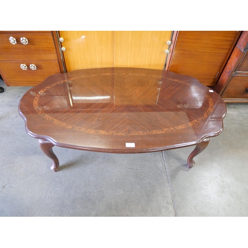 246 - A walnut effect oval coffee table