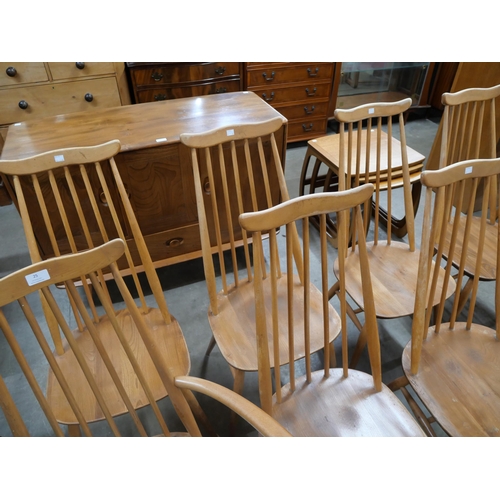 25 - A set of eight Ercol Blonde elm and beech Goldsmith chairs