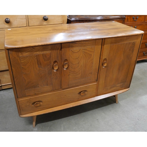 26 - An Ercol Blonde elm and beech Windsor sideboard