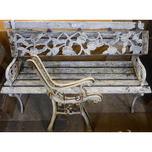 295 - A cast alloy garden bench and a pair of bench ends