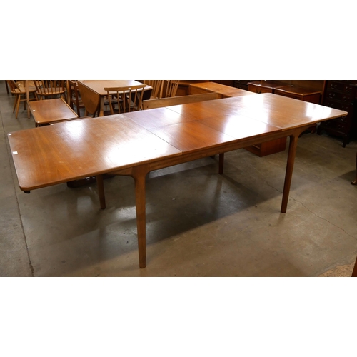 34 - A McIntosh T3 model teak extending dining table