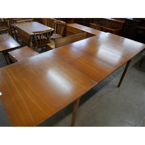 34 - A McIntosh T3 model teak extending dining table