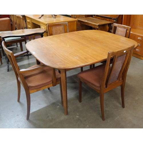 38 - A G-Plan Sierra teak extending dining table and four Fresco dining chairs